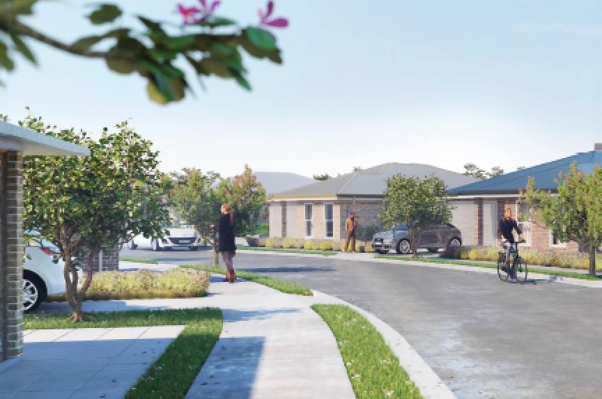 A tree-lined street of completed villas at Jemalong